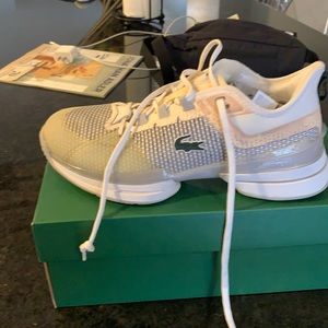 White Lacoste tennis shoes